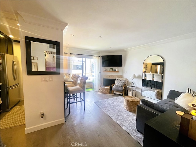 10960 Ashton Ave Unit 307, Los Angeles, CA 90024 - living area with crown molding, a fireplace, and wood finished floors