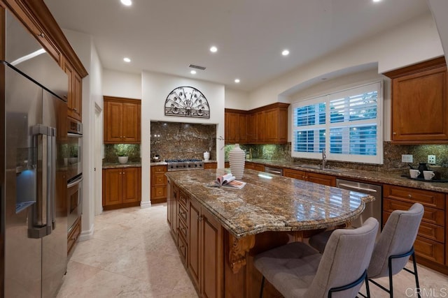 7845 Caminito Camelia, San Diego, CA 92127 - kitchen featuring stainless steel appliances, a sink, backsplash, and recessed lighting