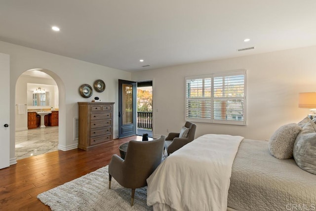 7845 Caminito Camelia, San Diego, CA 92127 - bedroom with arched walkways, access to outside, wood finished floors, recessed lighting, and baseboards