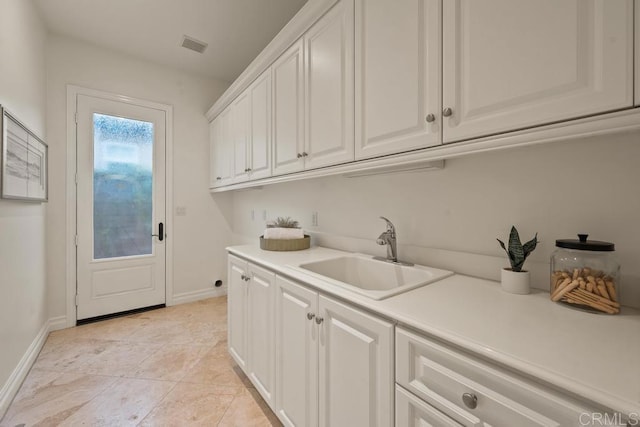 7845 Caminito Camelia, San Diego, CA 92127 - laundry area with a sink, baseboards, and light tile patterned floors