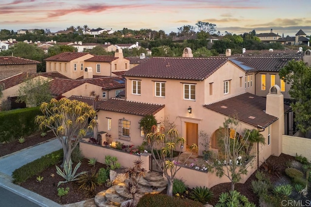 7845 Caminito Camelia, San Diego, CA 92127 - view of front of property featuring a tiled roof, stucco siding, a residential view, and a chimney