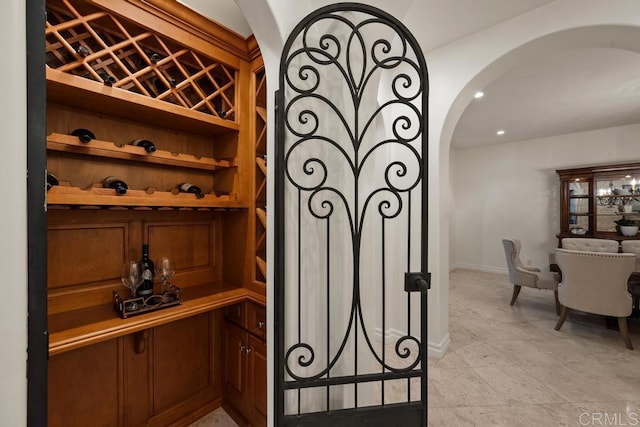 7845 Caminito Camelia, San Diego, CA 92127 - wine area with arched walkways, baseboards, and recessed lighting
