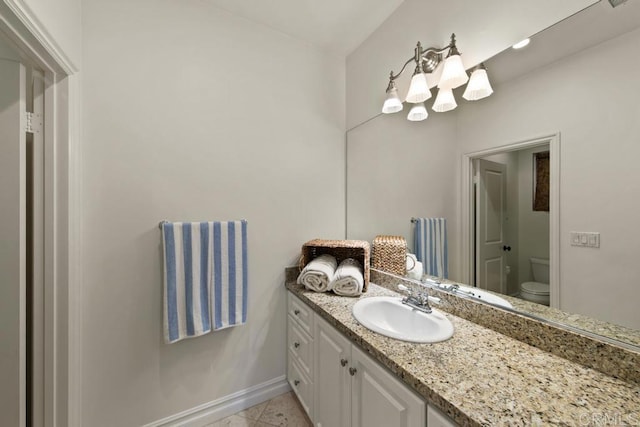 7845 Caminito Camelia, San Diego, CA 92127 - bathroom featuring vanity, toilet, baseboards, a chandelier, and tile patterned floors