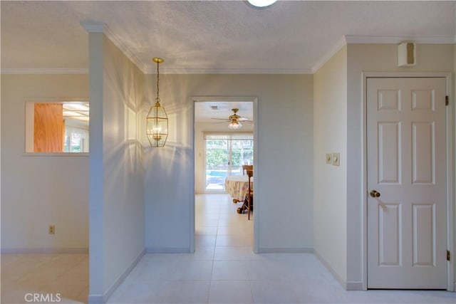 1375 San Gabriel Way, Merced, CA 95340 - corridor featuring baseboards, crown molding, a textured ceiling, and light tile patterned flooring