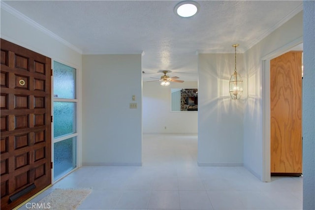 1375 San Gabriel Way, Merced, CA 95340 - foyer entrance with a ceiling fan, baseboards, crown molding, a textured ceiling, and a chandelier