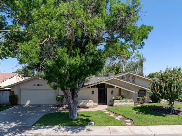 1375 San Gabriel Way, Merced, CA 95340 - view of front of house with stucco siding, a garage, driveway, and a front lawn