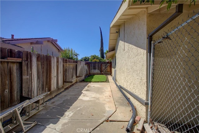 1375 San Gabriel Way, Merced, CA 95340 - view of home's exterior featuring stucco siding, a fenced backyard, and a patio area