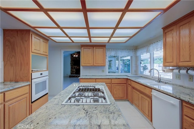 1375 San Gabriel Way, Merced, CA 95340 - kitchen featuring white appliances, a sink, light stone counters, and coffered ceiling