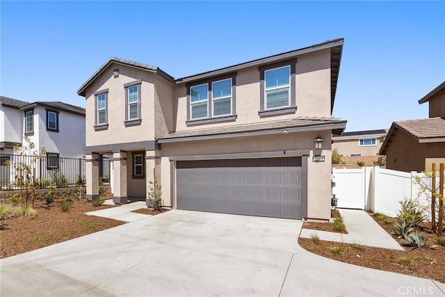 2544 Gunner Ridge Way, Rialto, CA 92377 - view of front facade featuring stucco siding, an attached garage, and concrete driveway