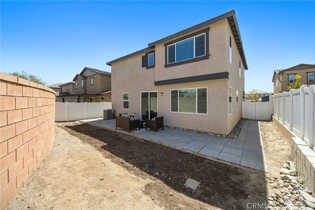 2544 Gunner Ridge Way, Rialto, CA 92377 - rear view of house with a fenced backyard, a patio, stucco siding, and central air condition unit