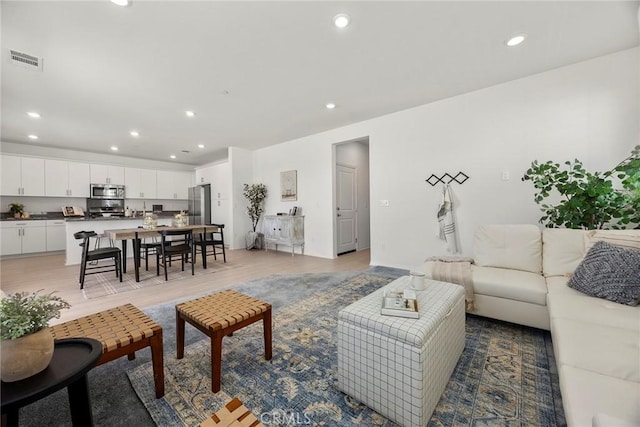 2544 Gunner Ridge Way, Rialto, CA 92377 - living area featuring recessed lighting and light wood-style flooring
