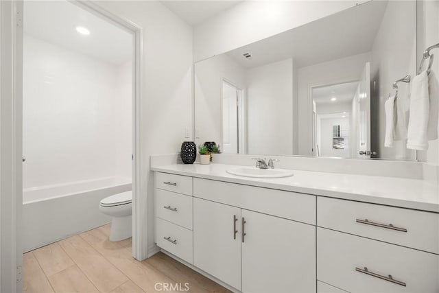 2544 Gunner Ridge Way, Rialto, CA 92377 - full bathroom with toilet, vanity, and wood finished floors