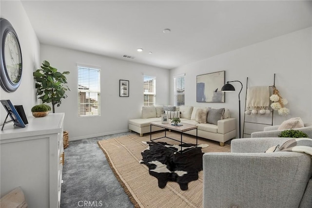 2544 Gunner Ridge Way, Rialto, CA 92377 - living room with plenty of natural light, light colored carpet, and baseboards