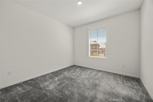 2544 Gunner Ridge Way, Rialto, CA 92377 - empty room featuring dark carpet and baseboards