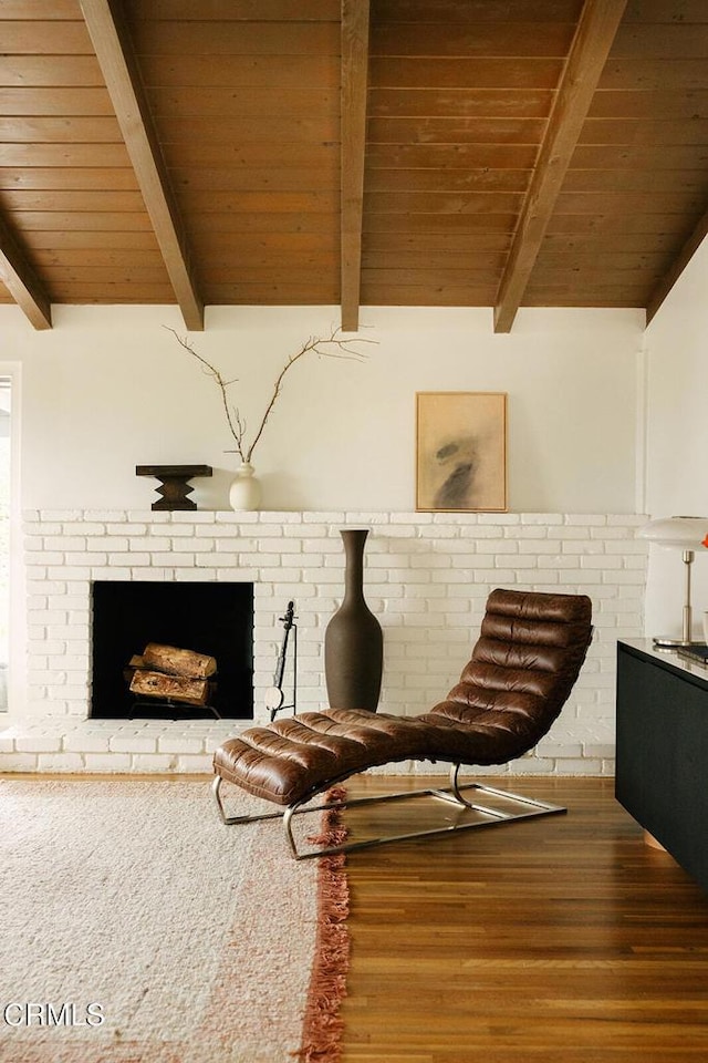 15845 Lassen St, North Hills, CA 91343 - sitting room featuring wooden ceiling with exposed beams, a fireplace, and wood finished floors