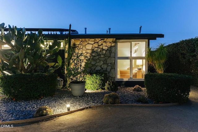 15845 Lassen St, North Hills, CA 91343 - view of side of home with stone siding