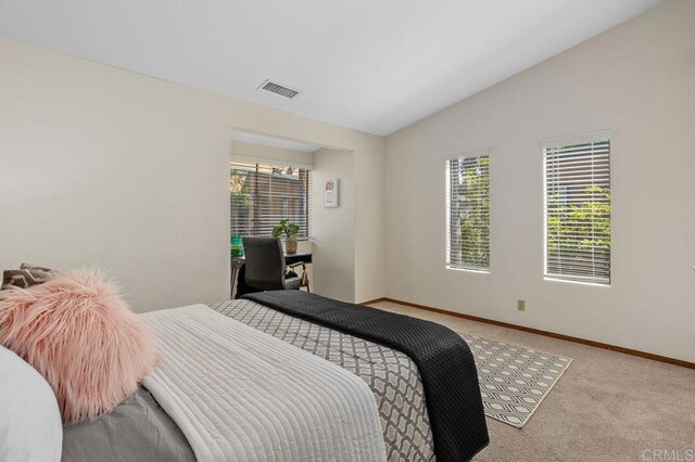 801 Kalpati Cir Unit B, Carlsbad, CA 92008 - carpeted bedroom with vaulted ceiling and baseboards