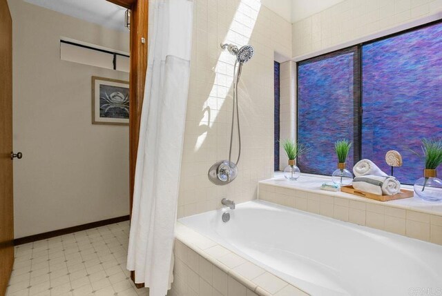 801 Kalpati Cir Unit B, Carlsbad, CA 92008 - bathroom with baseboards and tiled shower / bath