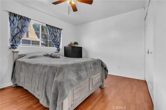 1144 Magnolia Ave, Gardena, CA 90247 - bedroom with wood finished floors, baseboards, and ceiling fan
