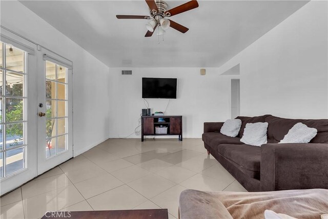 1144 Magnolia Ave, Gardena, CA 90247 - living room with light tile patterned flooring, ceiling fan, and french doors