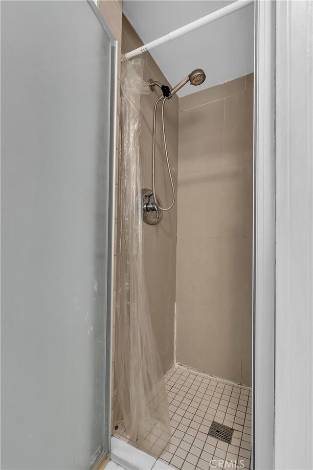 1144 Magnolia Ave, Gardena, CA 90247 - full bathroom featuring a shower stall and tile patterned floors