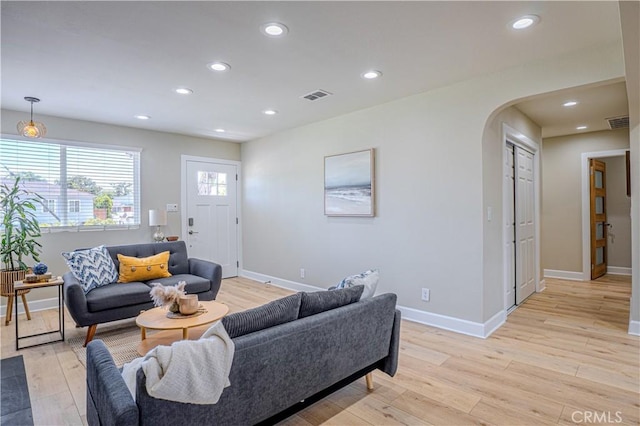417 E 44th Way, Long Beach, CA 90807 - living area with arched walkways, light wood-style floors, baseboards, and recessed lighting