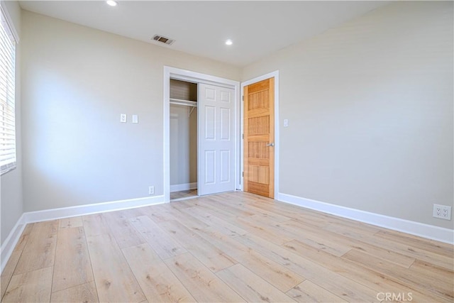 417 E 44th Way, Long Beach, CA 90807 - unfurnished bedroom with light wood-type flooring, baseboards, a closet, recessed lighting, and multiple windows