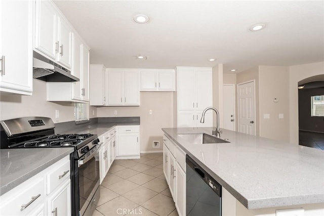 45529 36th St E, Lancaster, CA 93535 - kitchen with gas stove, under cabinet range hood, a sink, dishwasher, and white cabinetry