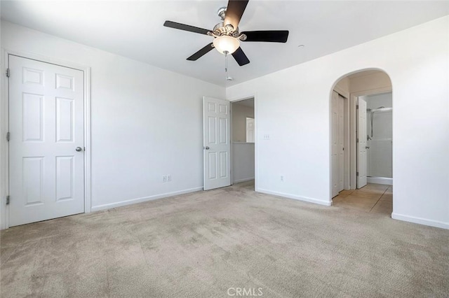 1587 N Strada Way, Clovis, CA 93619 - unfurnished bedroom with carpet, arched walkways, and a ceiling fan
