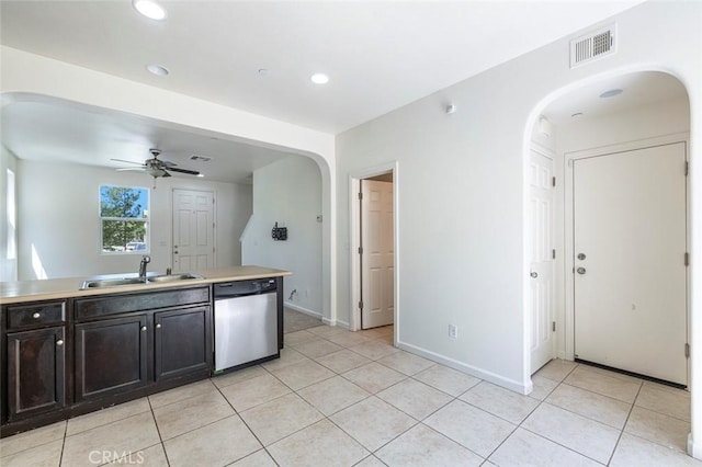 1587 N Strada Way, Clovis, CA 93619 - kitchen featuring stainless steel dishwasher, arched walkways, light tile patterned floors, and recessed lighting
