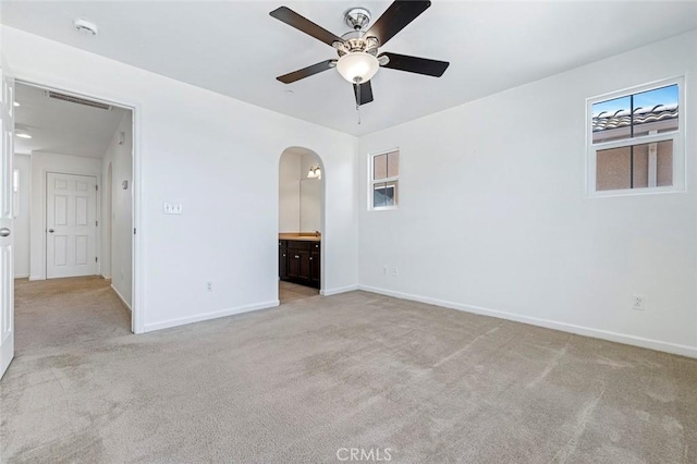 1587 N Strada Way, Clovis, CA 93619 - unfurnished room featuring a ceiling fan, light carpet, arched walkways, and a smoke detector