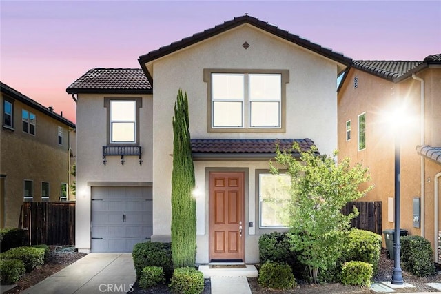 1587 N Strada Way, Clovis, CA 93619 - view of front facade featuring a tiled roof, stucco siding, an attached garage, and driveway