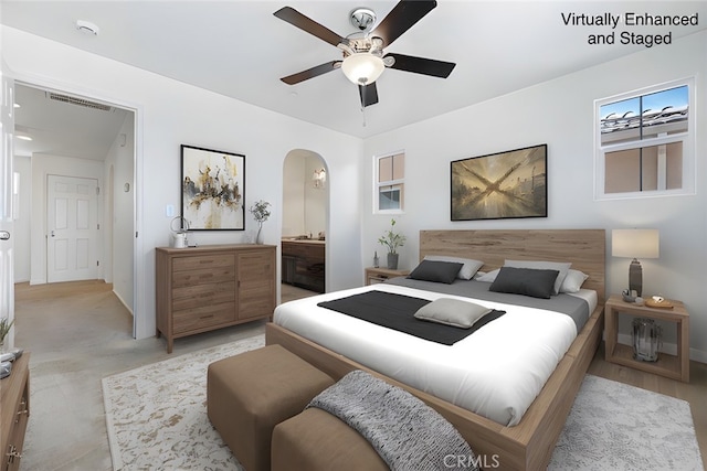 1587 N Strada Way, Clovis, CA 93619 - bedroom with arched walkways, a ceiling fan, and ensuite bath