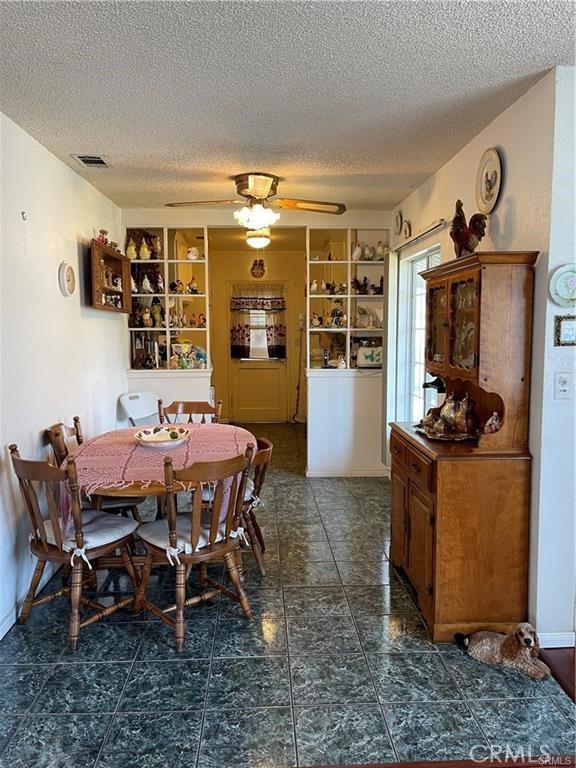 811 Walnut, Colton, CA 92324 - dining area with a textured ceiling and ceiling fan