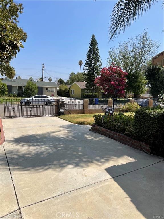 811 Walnut, Colton, CA 92324 - view of concrete surface with a gated entry and a gate