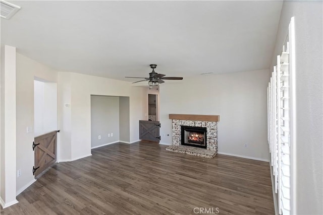 1825 Duncan Way, Corona, CA 92881 - unfurnished living room featuring wood finished floors, a ceiling fan, baseboards, and a stone fireplace