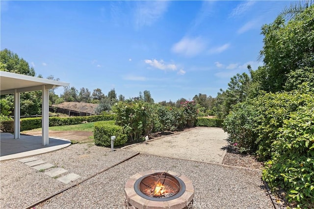 1825 Duncan Way, Corona, CA 92881 - view of yard with an outdoor fire pit and a patio