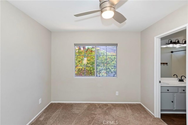 1825 Duncan Way, Corona, CA 92881 - unfurnished bedroom with baseboards, dark colored carpet, ensuite bathroom, and a ceiling fan