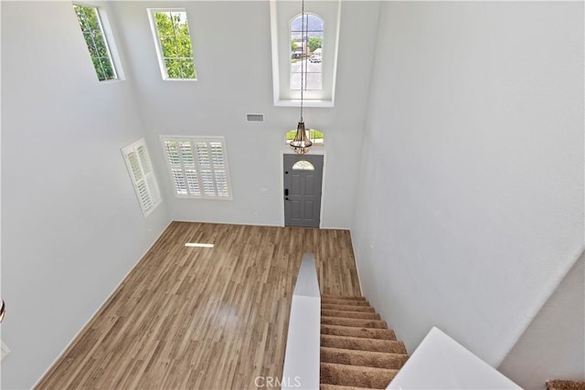 1825 Duncan Way, Corona, CA 92881 - foyer entrance with a high ceiling, wood finished floors, healthy amount of natural light, and stairway