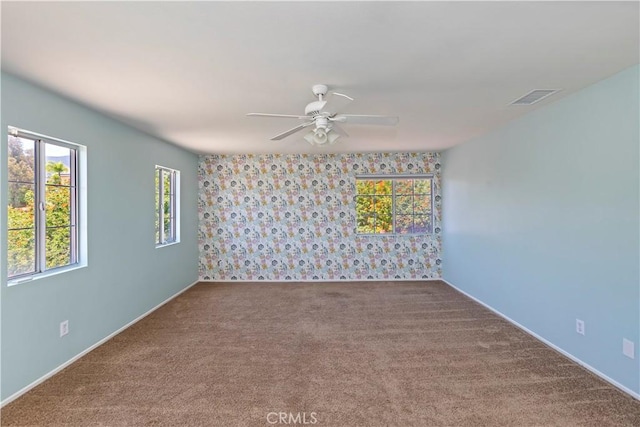 1825 Duncan Way, Corona, CA 92881 - empty room featuring ceiling fan, carpet floors, baseboards, and wallpapered walls
