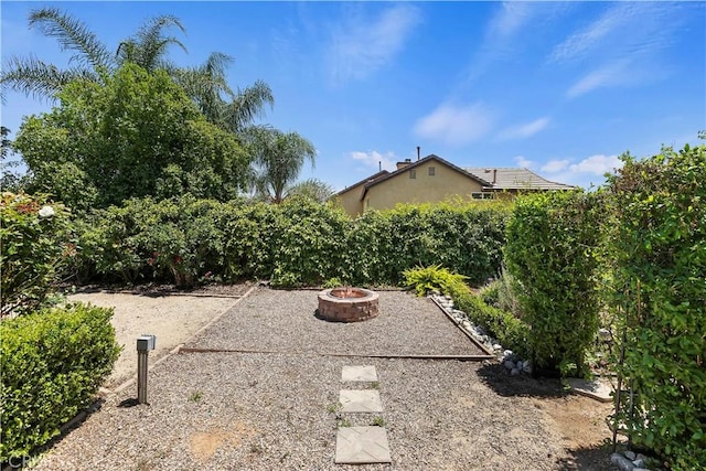 1825 Duncan Way, Corona, CA 92881 - view of yard featuring an outdoor fire pit and a patio area