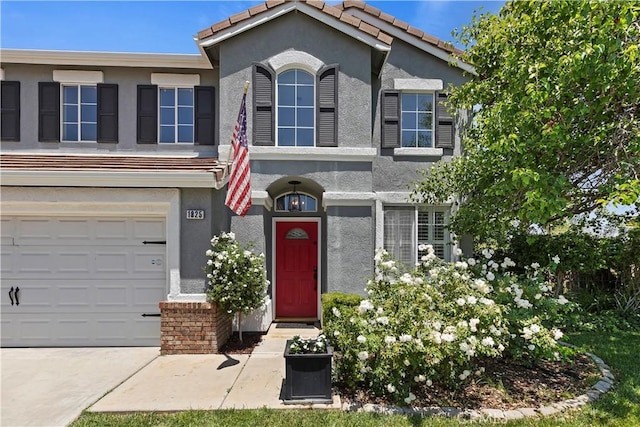 1825 Duncan Way, Corona, CA 92881 - view of front of house featuring stucco siding, a garage, concrete driveway, and a tiled roof