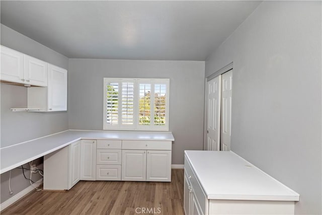 1825 Duncan Way, Corona, CA 92881 - kitchen featuring wood finished floors, white cabinets, light countertops, and baseboards