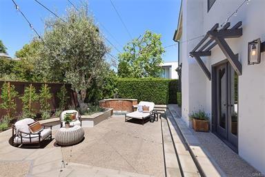 411 Snug Harbor Rd, Newport Beach, CA 92663 - fenced backyard with a patio area, an outdoor living space, and french doors