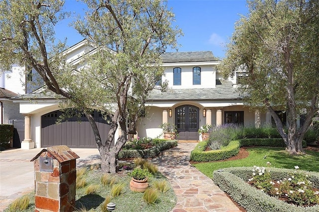 411 Snug Harbor Rd, Newport Beach, CA 92663 - traditional-style home featuring french doors, stucco siding, concrete driveway, and a garage