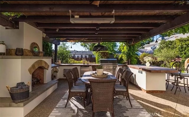 411 Snug Harbor Rd, Newport Beach, CA 92663 - view of patio / terrace with a fireplace, exterior bar, and outdoor dining space