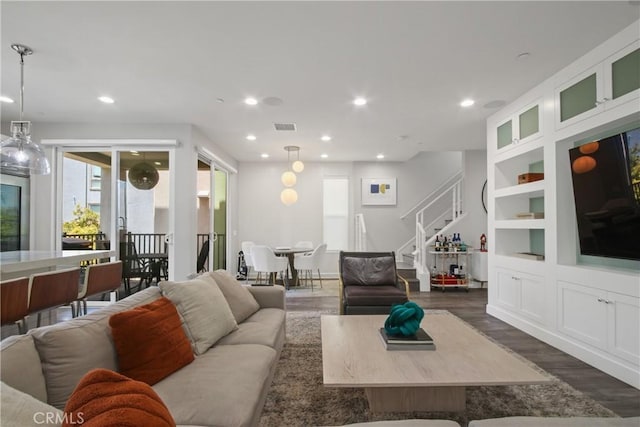 1639 Bridgewater Way, Costa Mesa, CA 92627 - living area with stairs, dark wood-type flooring, recessed lighting, and built in shelves