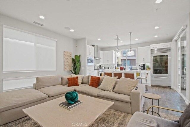 1639 Bridgewater Way, Costa Mesa, CA 92627 - living room with light wood-type flooring and recessed lighting