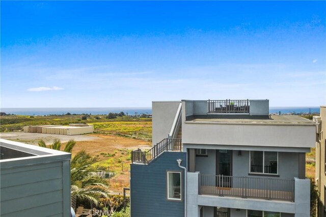 1639 Bridgewater Way, Costa Mesa, CA 92627 - view of property exterior with a balcony and stucco siding