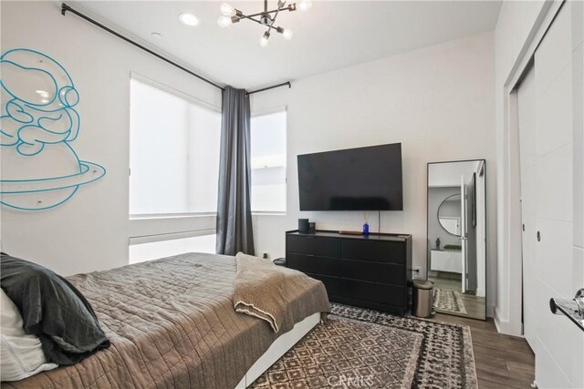 1639 Bridgewater Way, Costa Mesa, CA 92627 - bedroom with wood finished floors, a chandelier, and a closet